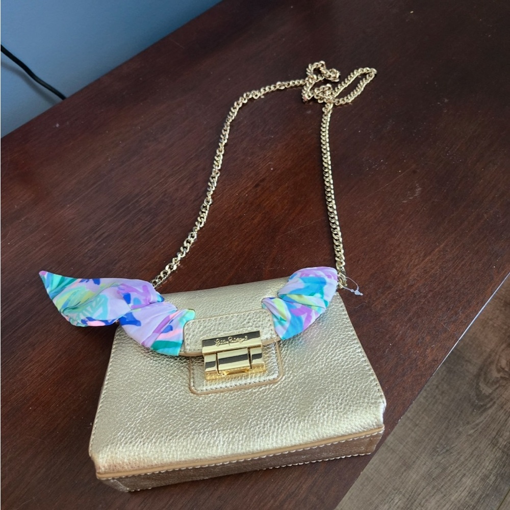 Lilly Pulitzer Gold Crossbody Bag with Colorful Scarf Accent

New, never used